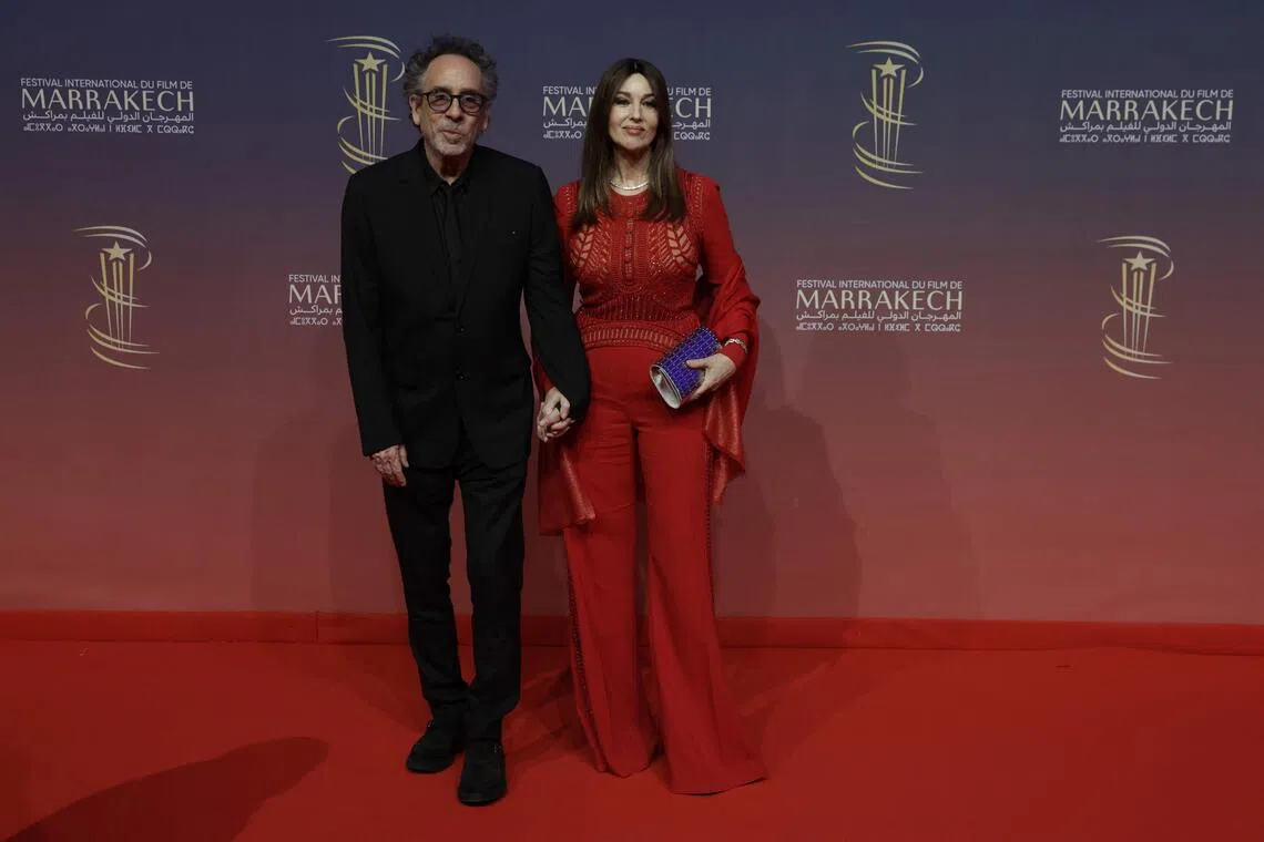 Italian actress Monica Bellucci (right) and US film director Tim Burton attend the Marrakesh International Film Festival in Marrakesh on Nov 30, 2024. The couple announced their split in a statement on Sept 19, 2025. 