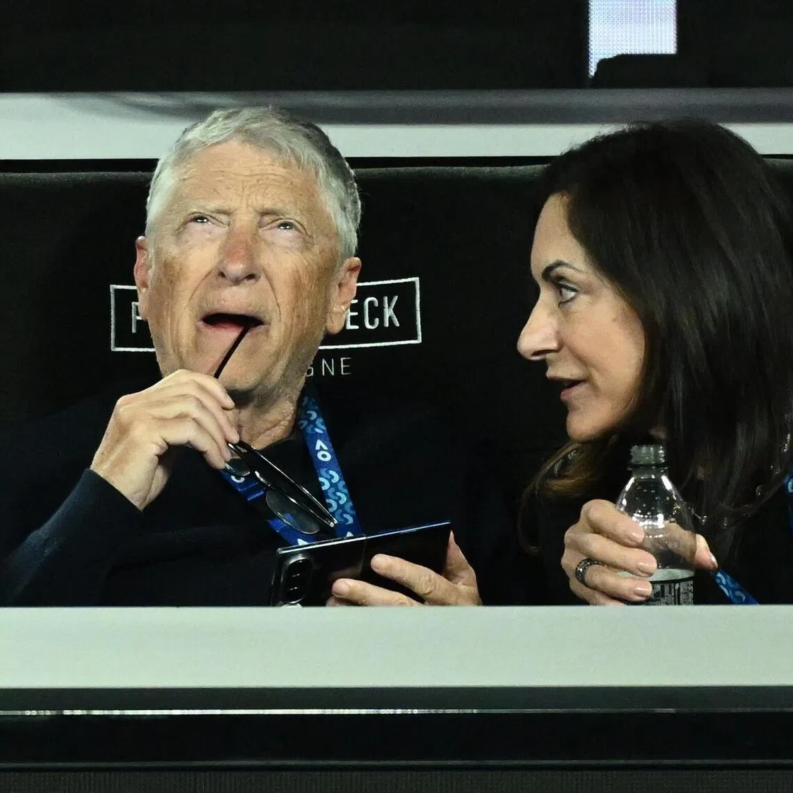 Bill Gates (left) with his partner Paula Hurd at the Australian Open tennis tournament in Melbourne on Jan 31, 2026. 