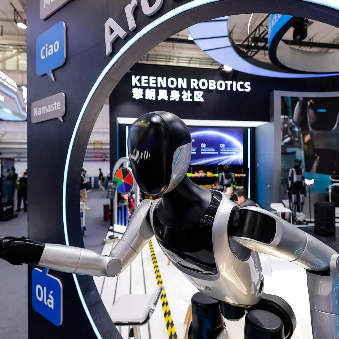 Humanoid robots are on display at the Keenon Robotics booth at the 2026 World Robot Conference, in Beijing.