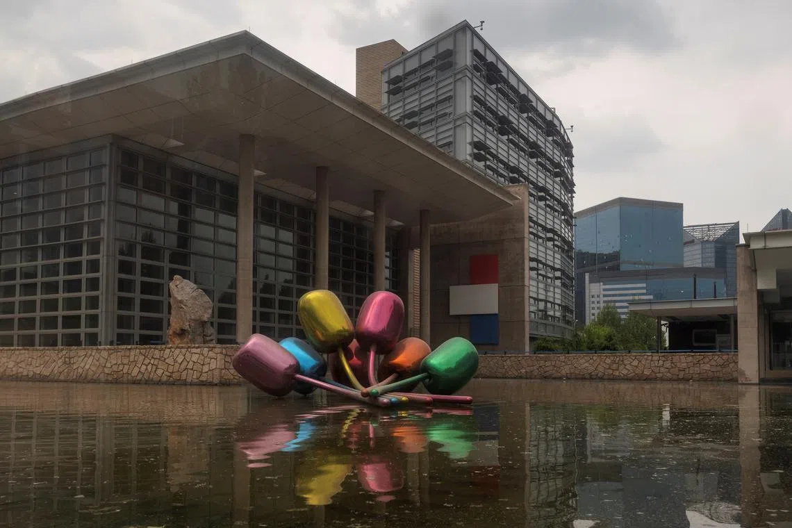 FILE PHOTO: A general view shows the buildings of the U.S. Embassy in Beijing, China, April 21, 2021. Picture taken through a window. REUTERS/Thomas Peter/File Photo