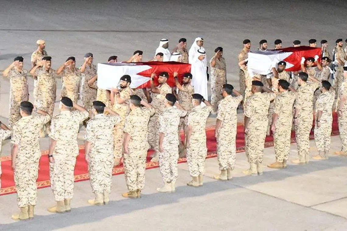 FILE PHOTO: A screen grab from a video shows the arrival of the bodies of two Bahrain Defence Force officers, who were killed in a Houthi drone attack against forces of the Saudi-led coalition in Saudi Arabia near the border with Yemen, at Bahrain Royal Air Force Base in Jaw, Bahrain, September 26, 2023. Bahrain News Agency/Handout via REUTERS/File Photo