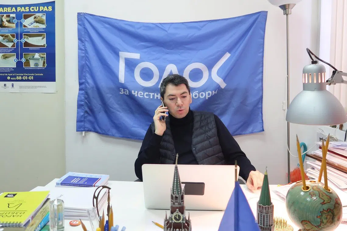 Co-chairman of Golos non-governmental organisation Grigory Melkonyants speaks on the phone at his office in Moscow, Russia March 13, 2018. Picture taken March 13, 2018. REUTERS/Andrew Osborn/File Photo