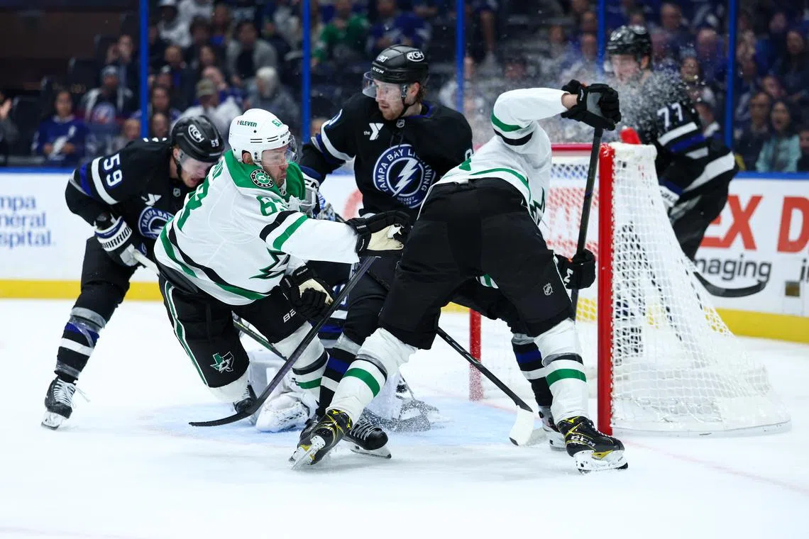 FILE PHOTO: Nov 23, 2024; Tampa, Florida, USA; Dallas Stars right wing Evgenii Dadonov (63) crashes into Tampa Bay Lightning goaltender Andrei Vasilevskiy (88) in the second period at Amalie Arena. Nathan Ray Seebeck-Imagn Images/File Photo