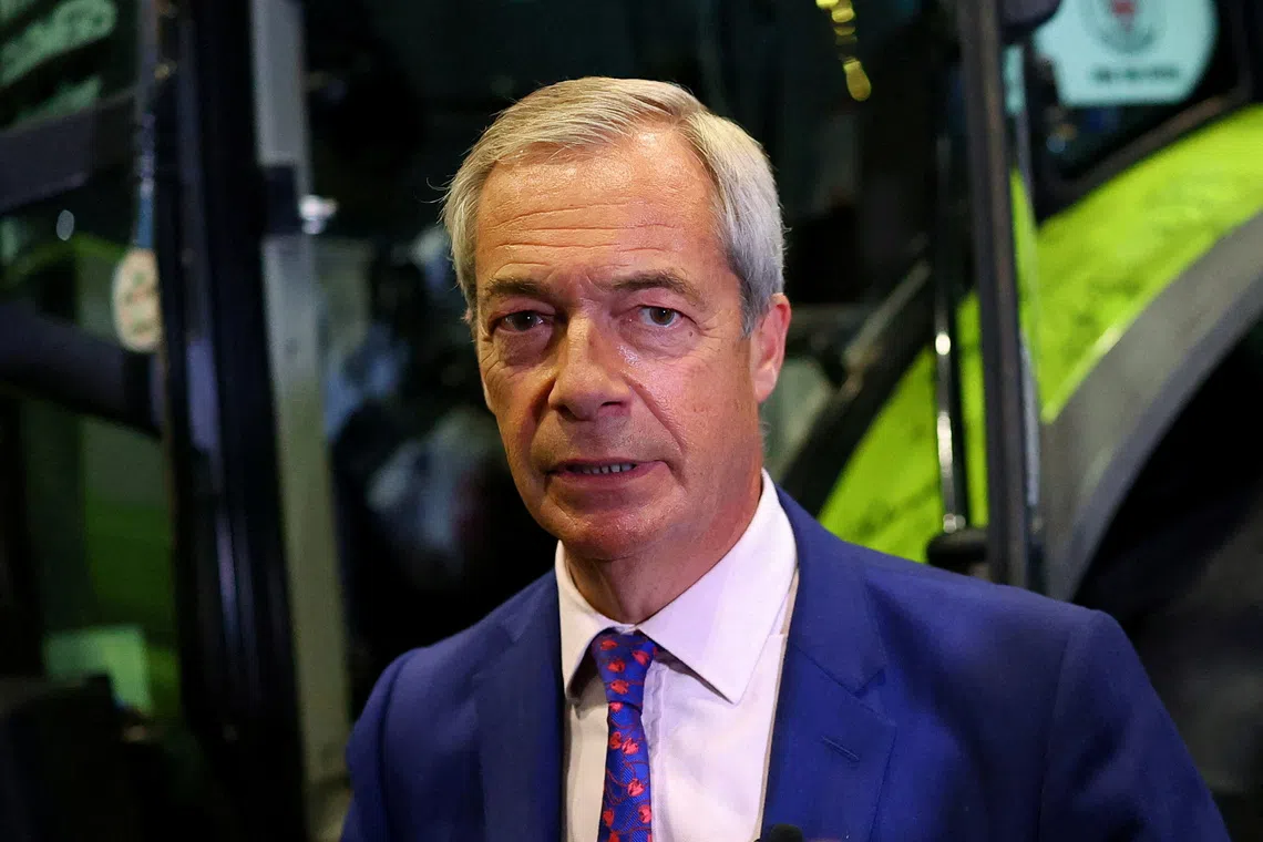 FILE PHOTO: Britain's Reform UK party leader Nigel Farage stands next to a tractor during the Reform UK party conference, in Birmingham, Britain, September 6, 2025. REUTERS/Isabel Infantes/File Photo