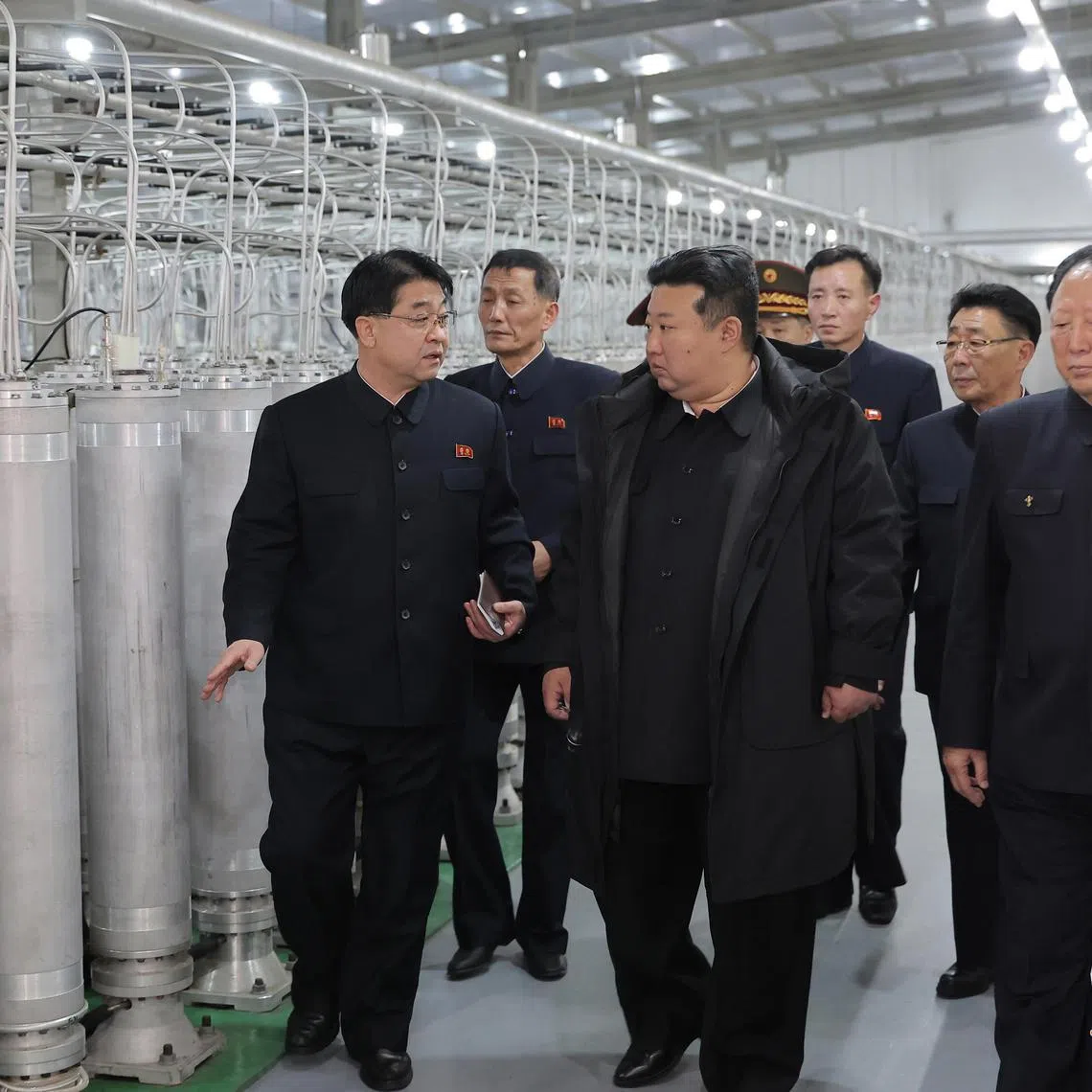 North Korean leader Kim Jong Un (right) inspecting a nuclear material production base on Jan 29.