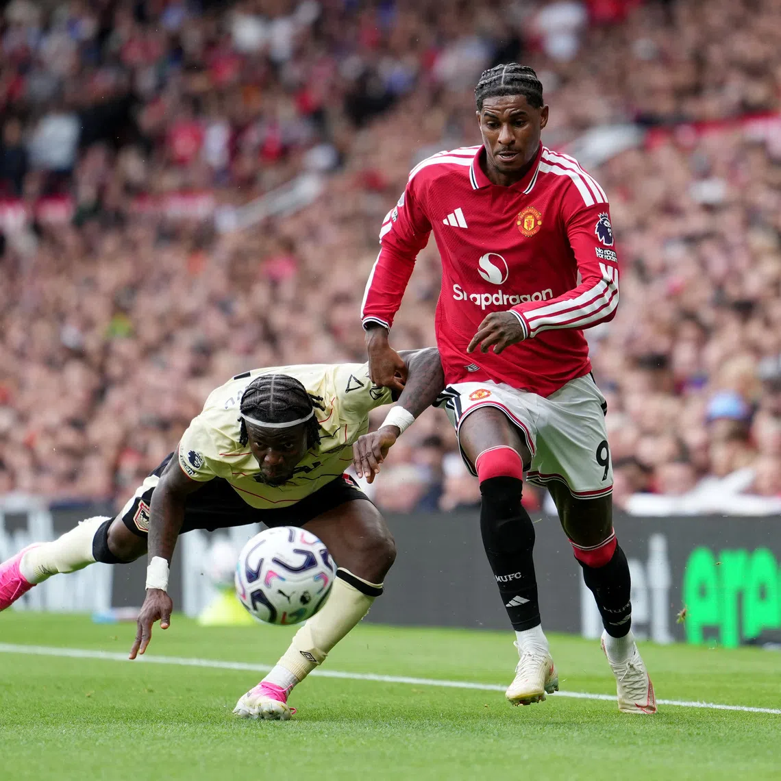 Manchester United’s Marcus Rashford vies for the ball with Ipswich Town’s Abdul Fatawu during their Premier League match on Aug 30.