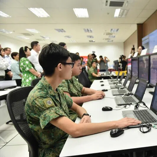 National servicemen undergoing cybersecurity training at the Cyber Defence Test and Experimentation Centre. The upgraded centre will be able to simulate sophisticated scenarios using AI.