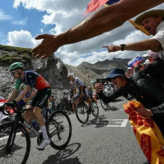 Decathlon CMA CGM Team’s French rider Paul Seixas (left) and UAE Team Emirates-XRG’s Mexican rider Isaac Del Toro (centre) cycling in the Col du Galibier ascent during the 20th stage of the Tour de France on July 25.