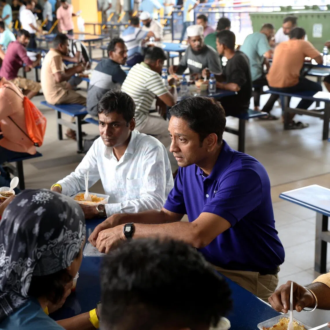 Minister of State for Manpower Dinesh Vasu Dash (right) with migrant workers from KPA Engineering, SK Industries and VVR Plant Engineering at Kranji Recreation Centre on June 28.