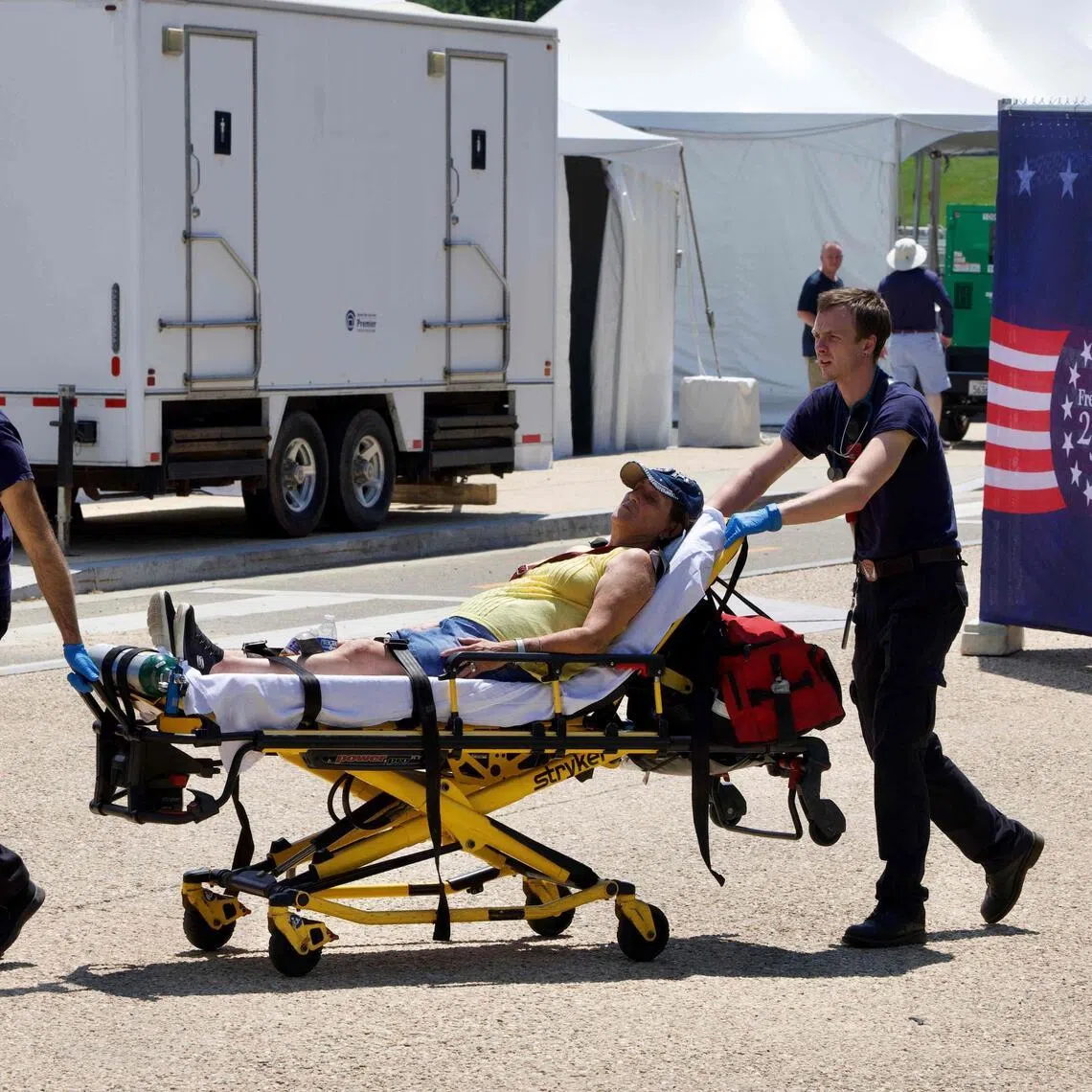 A person is helped by first responders in Washington on July 3, as high temperatures grip the US capital ahead of Independence Day celebrations.