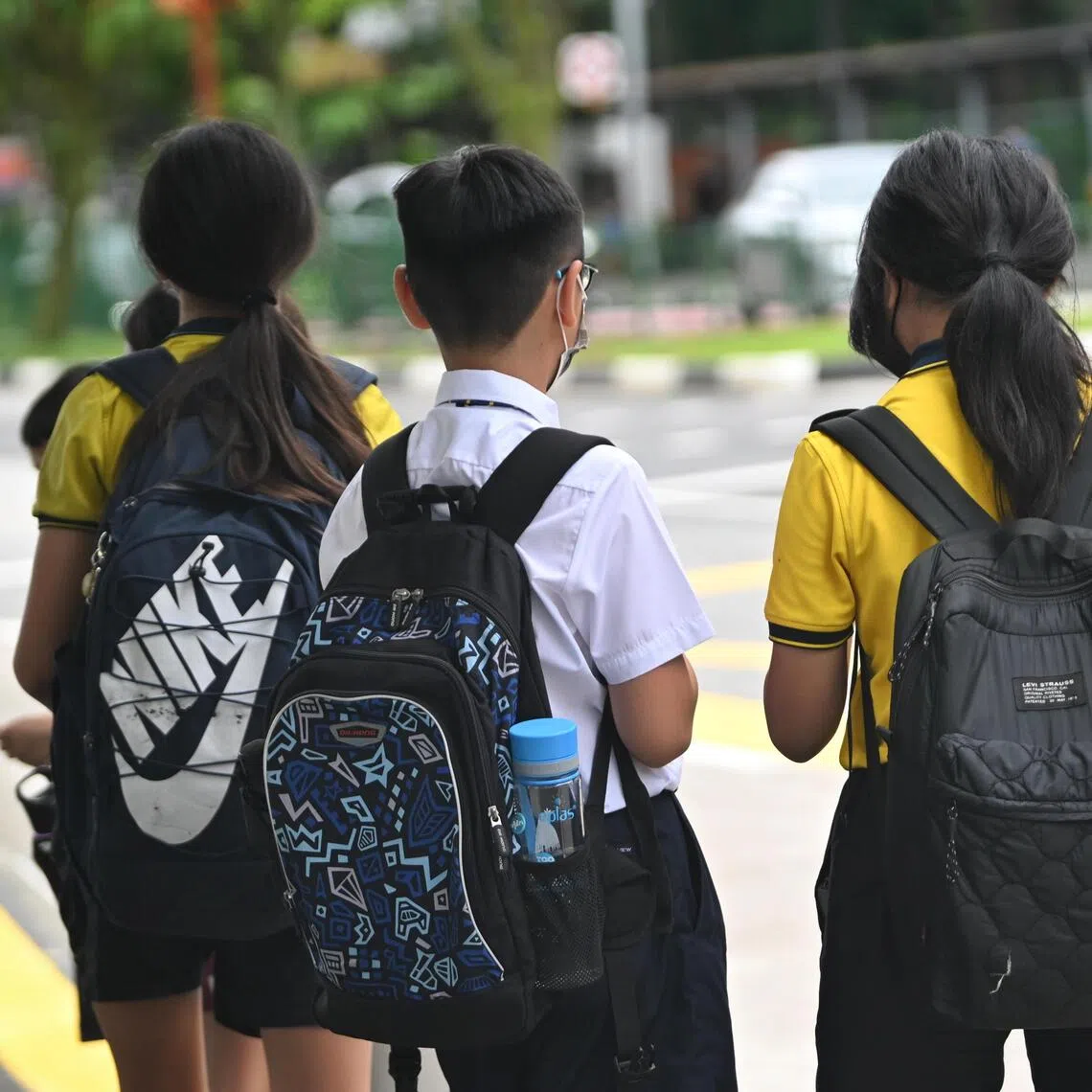 Generic photo of Punggol View Primary School  students with school bags waiting for a public bus on January 4, 2022