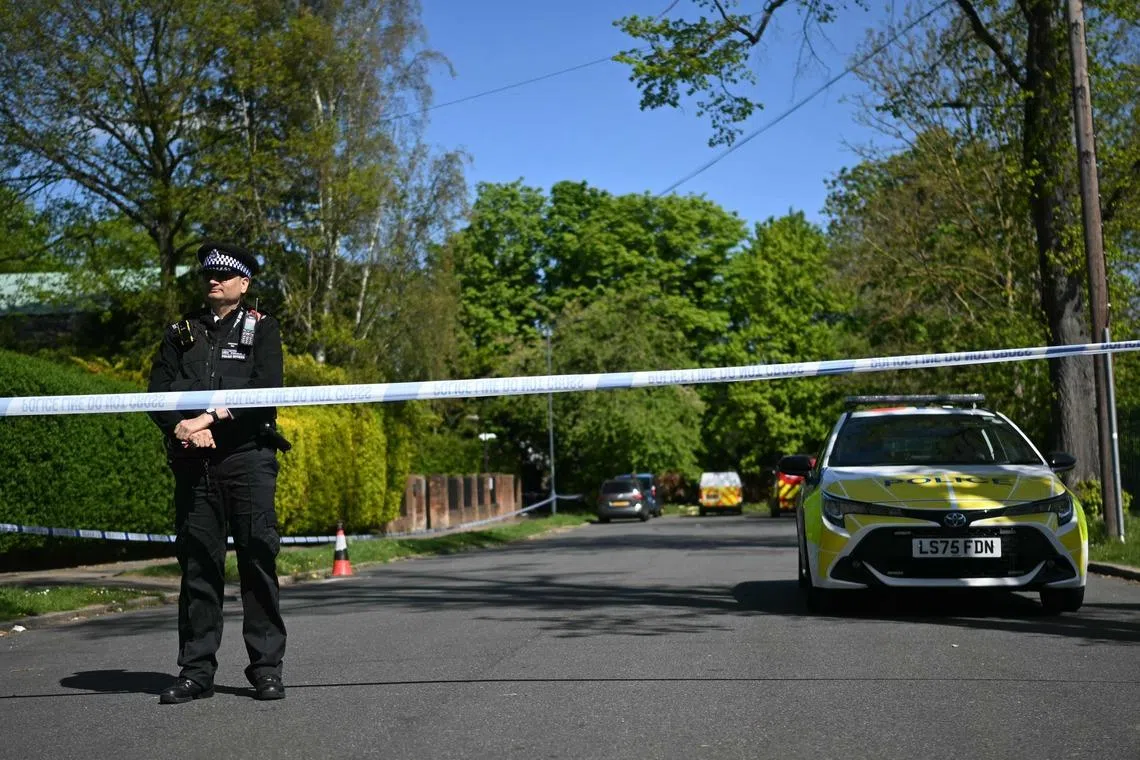 A police officer stands inside a cordon set up near to Kenton United Synagogue in Harrow, north-west London, on April 19.