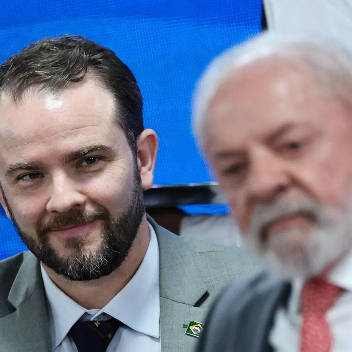 Brazil's Executive Secretary of the Ministry of Finance Dario Durigan looks on behind Brazil's President Luiz Inacio Lula da Silva during a ceremony to launch a digital platform for tax reform in Brasilia, Brazil January 13, 2026. REUTERS/Adriano Machado