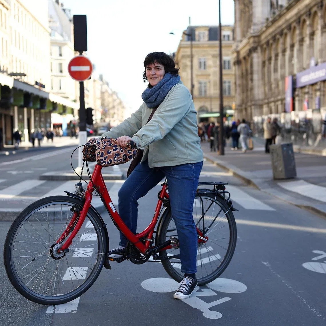 Parisian bike enthousiast Marion Soulet, of the Paris en Selle association, poses on a bicycle path after an interview with Reuters in Paris, France, March 2, 2026. REUTERS/Abdul Saboor