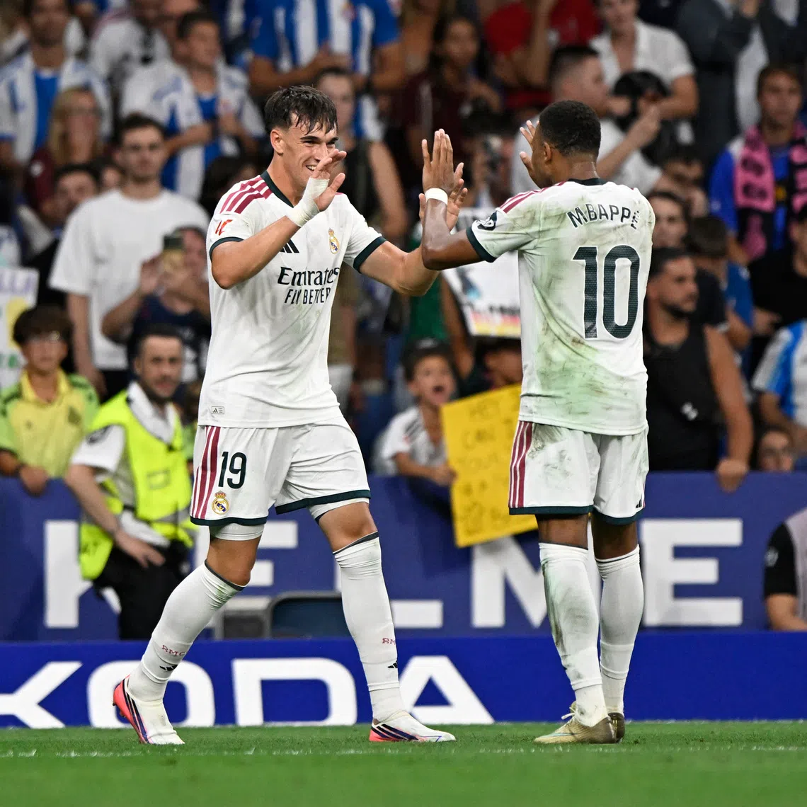 Real Madrid’s Carlos Espi celebrates scoring their second goal with Kylian Mbappe.