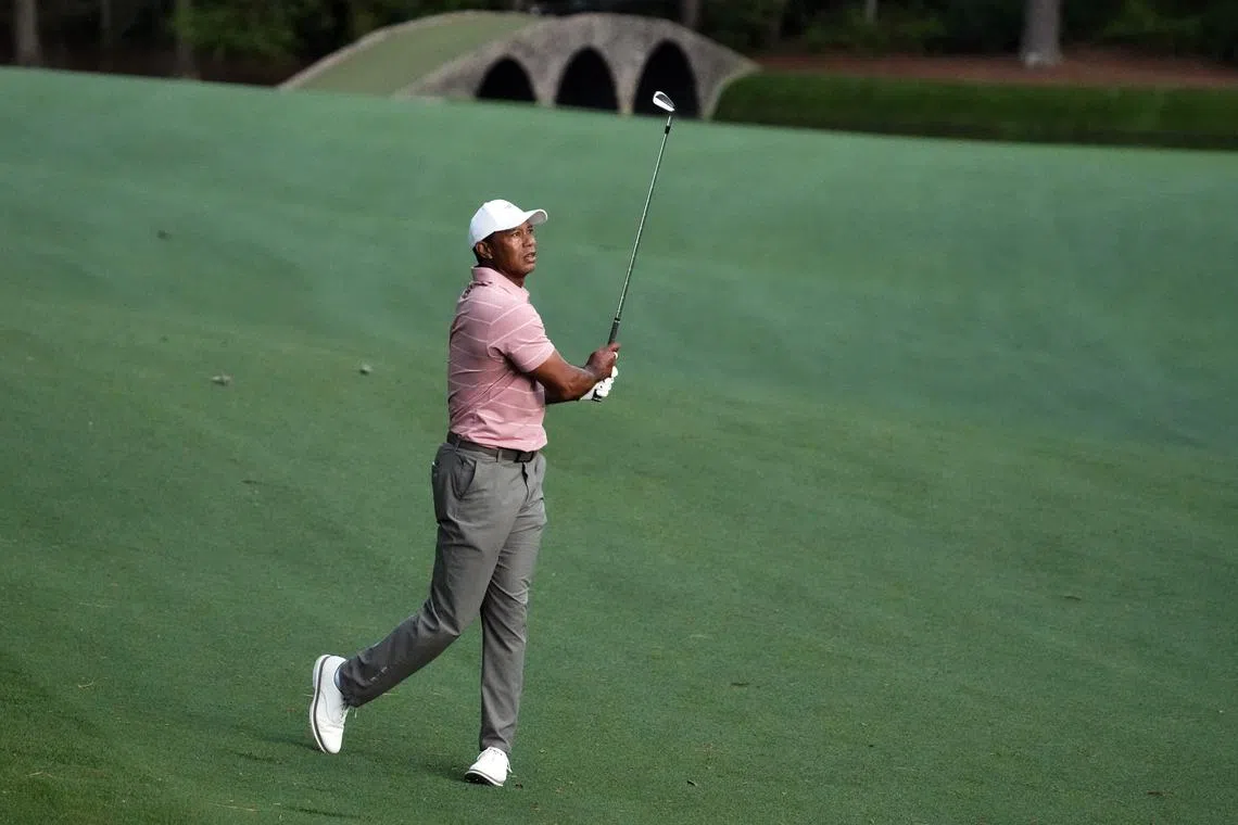 Apr 11, 2024; Augusta, Georgia, USA; Tiger Woods hits his third shot on No. 13 during the first round of the Masters Tournament. Mandatory Credit: Rob Schumacher-USA TODAY Network