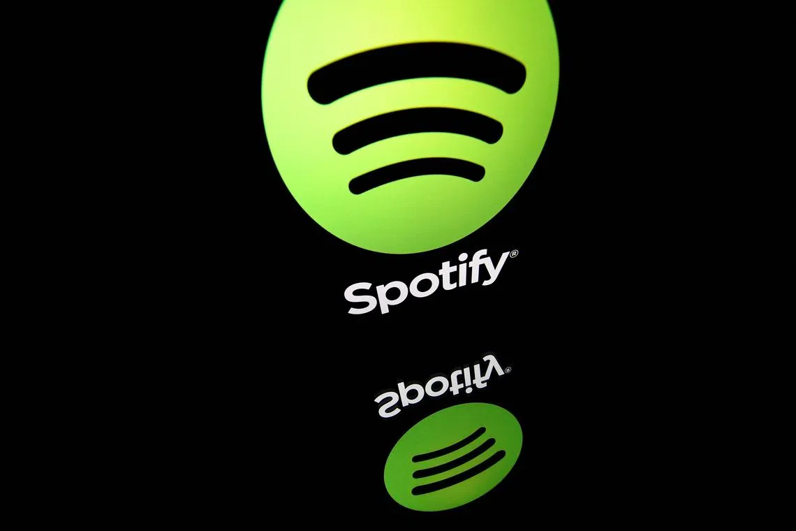 (FILES) (FILES) In this file photo illustration taken on April 19, 2018 shows the logo of online streaming music service Spotify displayed on a tablet screen in Paris. An Elysee communique released on June 21, the date of France's national "Fete de la Musique" (music festival), opened the possibility of prospective tax levied on music streaming platforms. (Photo by Lionel BONAVENTURE / AFP)