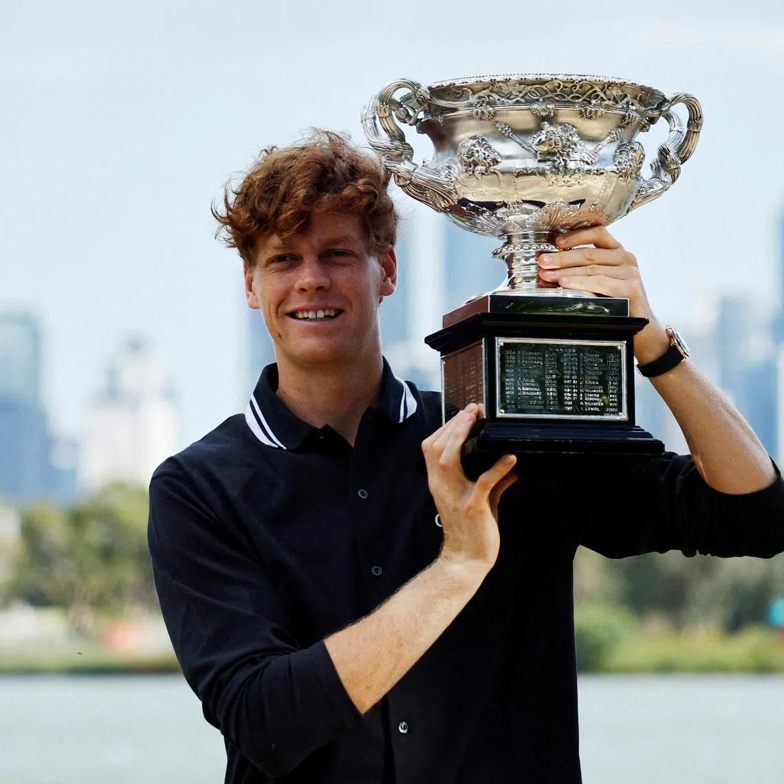 Tennis - Australian Open - Men's Singles Winner Photo Shoot - Albert Park Lake, Melbourne, Australia - January 27, 2025 Italy's Jannik Sinner poses with the Australian Open trophy REUTERS/Francis Mascarenhas
