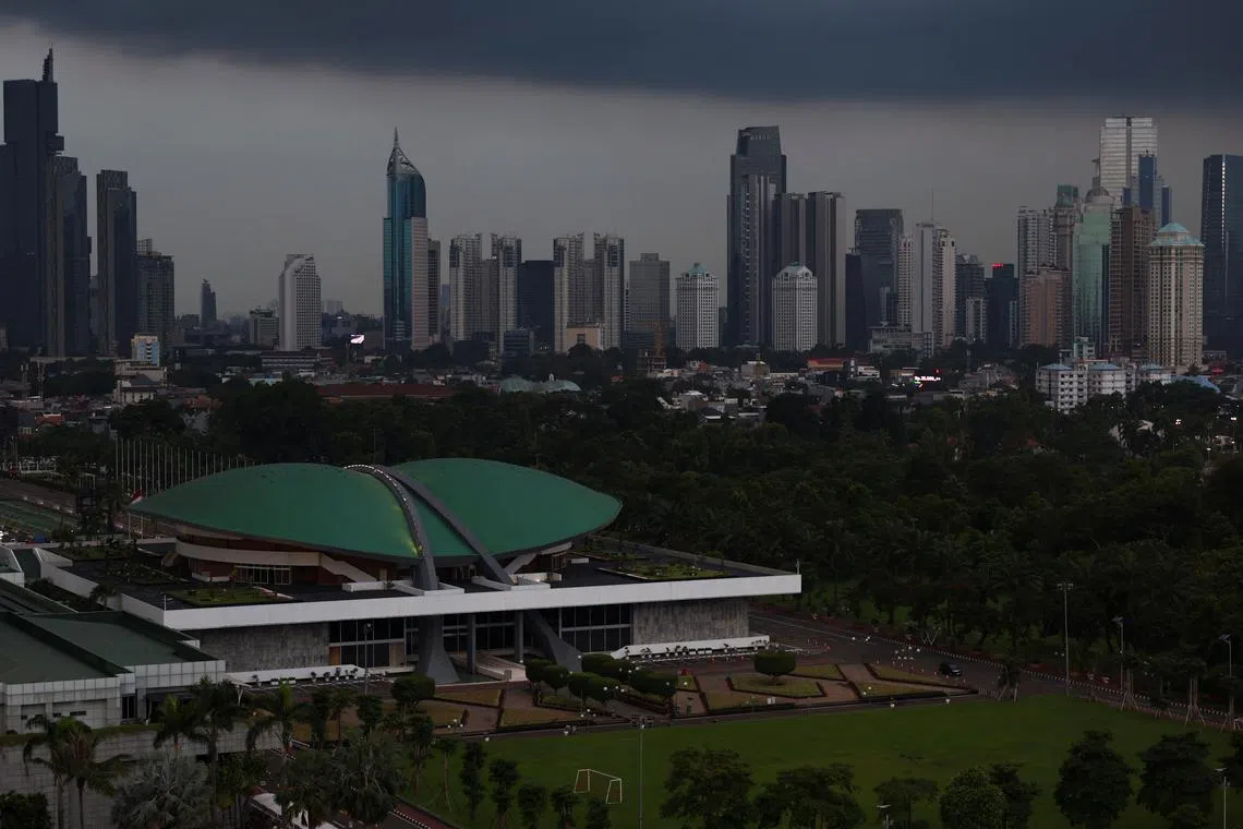 FILE PHOTO: Indonesian Parliament building stands with the skyline in the background in Jakarta, Indonesia, April 25, 2025. REUTERS/Willy Kurniawan/File Photo