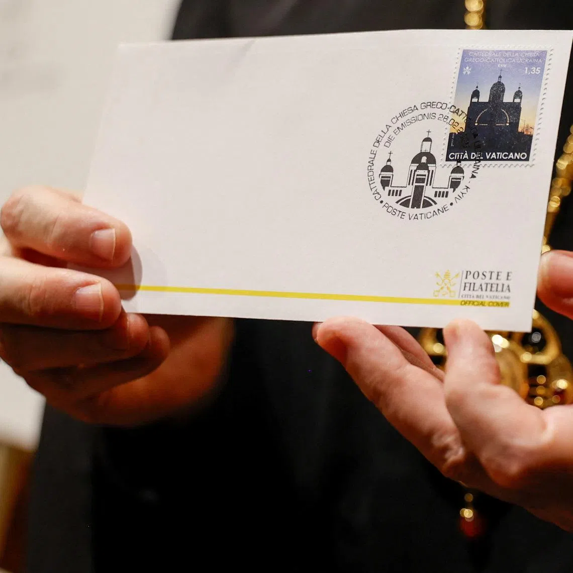 A newly issued Vatican postage stamp honouring Catholics in Ukraine is pasted on an envelope at the Vatican, February 26, 2026. REUTERS/Antonio Denti