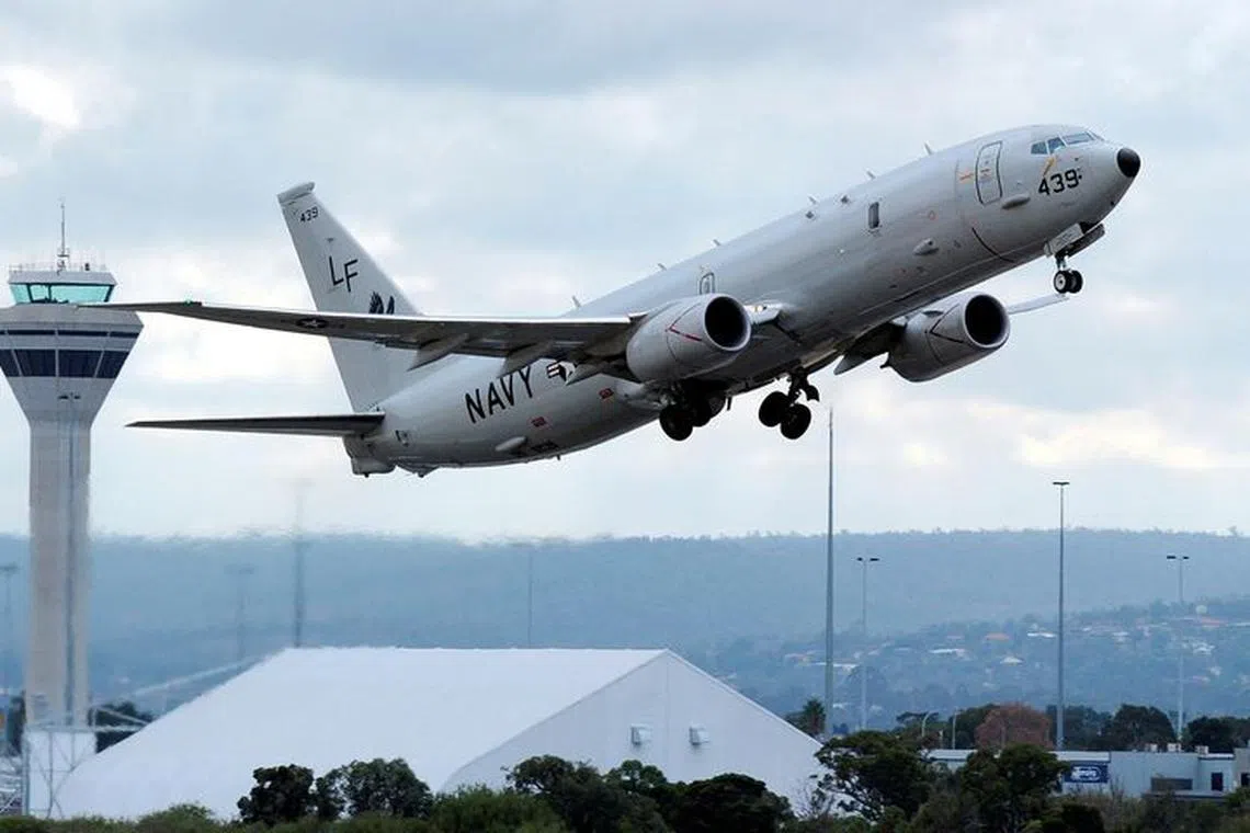 FILE PHOTO: A U.S. Navy P-8 Poseidon aircraft takes off from Perth International Airport, April 16, 2014. REUTERS/Greg Wood/Pool/File Photo