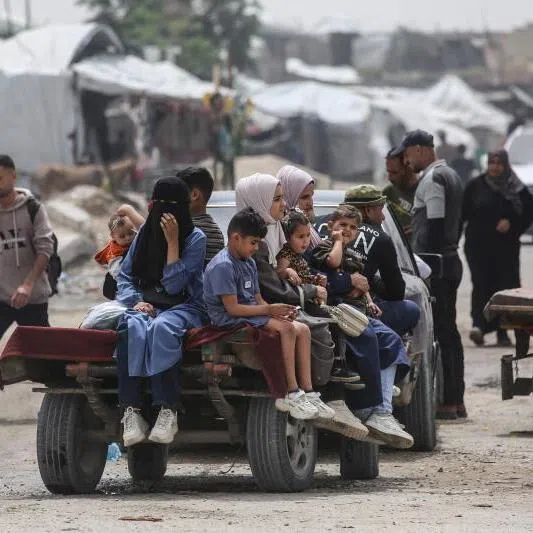 Palestinians sitting on a trailer in Khan Younis in the southern Gaza Strip on April 18, 2026. The Israeli military campaign has killed more than 72,000 people in Gaza, according to the Hamas-run territory’s health ministry.
