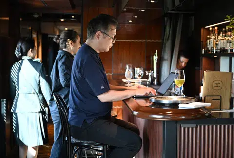 Japanese author Toh EnJoe working aboard the Mizukaze train on Oct 22. The central theme and overall narrative of the novel were discussed before departure, but the plot – set aboard the “Mizukaze” itself – will take shape as the journey unfolds.