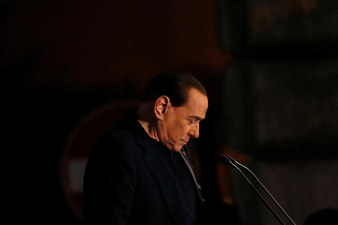 FILE PHOTO: Former Prime Minister Silvio Berlusconi delivers a speech from the stage in downtown Rome November 27, 2013. REUTERS/Alessandro Bianchi/File Photo
