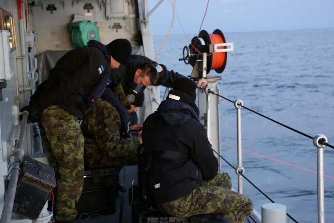 FILE PHOTO: Estonian Navy conducts an undersea communications cable survey after a subsea gas pipeline and a telecommunications cable connecting Finland and Estonia under the Baltic Sea was damaged, in the Gulf of Finland, October 10, 2023. Estonian Navy Handout/Handout via REUTERS/File Photo