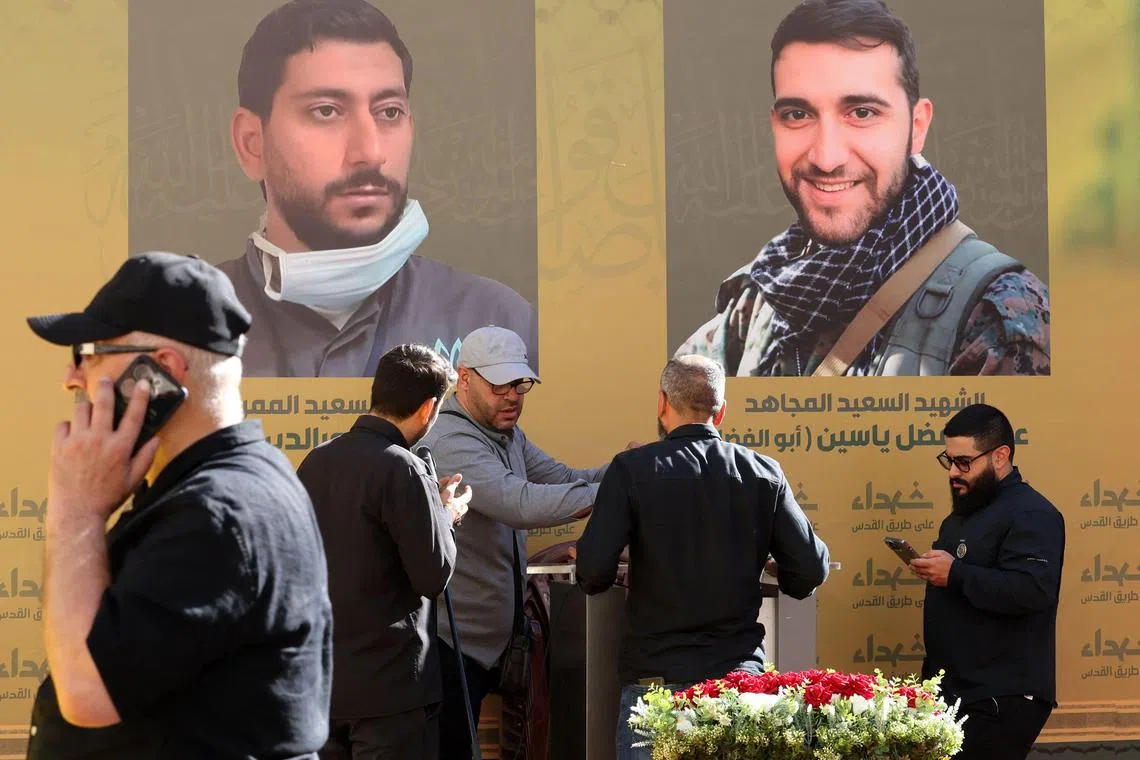 Hezbollah members and mourners attend the funeral of a person killed after hundreds of pagers exploded in a deadly wave across Lebanon.