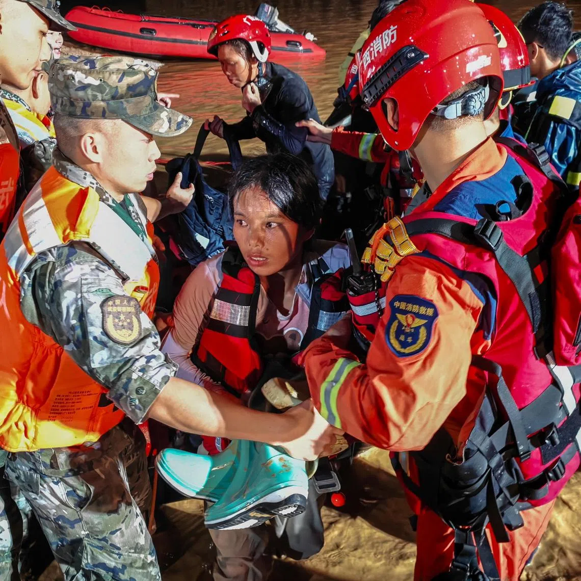 Rescue workers evacuate residents after heavy rainfall brought by Typhoon Maysak in Hengzhou, Guangxi Zhuang Autonomous Region, China, on July 6.