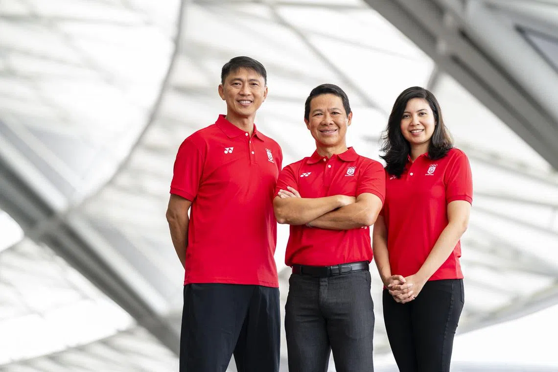 Dr Hing Siong Chen, chef de mission for Singapore at the Cambodia SEA Games, is flanked by his assistants, former national footballer Lim Tong Hai (left) and ex-national bowler Jasmine Yeong-Nathan. 
