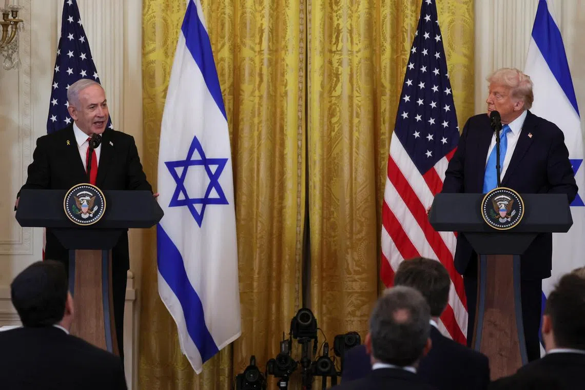 FILE PHOTO: U.S. President Donald Trump and Israeli Prime Minister Benjamin Netanyahu hold a joint press conference in the East Room at the White House in Washington, U.S., February 4, 2025. REUTERS/Leah Millis/ File Photo