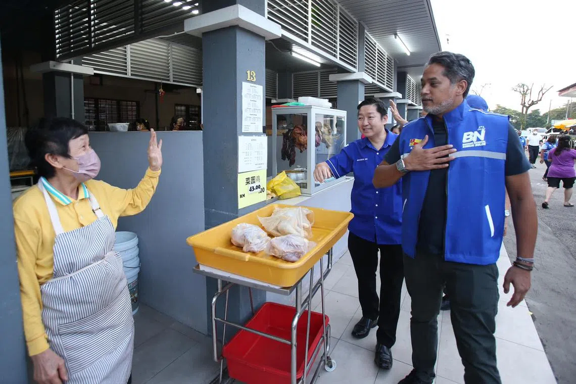 Khairy Jamaluddin on a walkabout at a market in Sungai Buloh constituency.