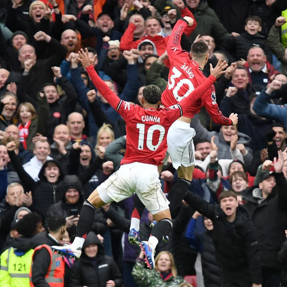 Soccer Football - Premier League - Manchester United v Aston Villa - Old Trafford, Manchester, Britain - March 15, 2026 Manchester United's Benjamin Sesko celebrates scoring their third goal with Matheus Cunha REUTERS/Peter Powell