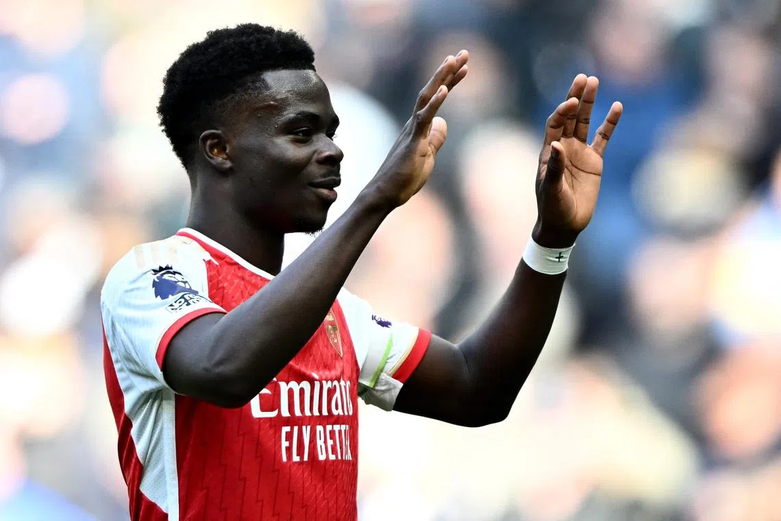 Soccer Football - Premier League - Tottenham Hotspur v Arsenal - Tottenham Hotspur Stadium, London, Britain - April 28, 2024 Arsenal's Bukayo Saka celebrates after the match REUTERS/Dylan Martinez