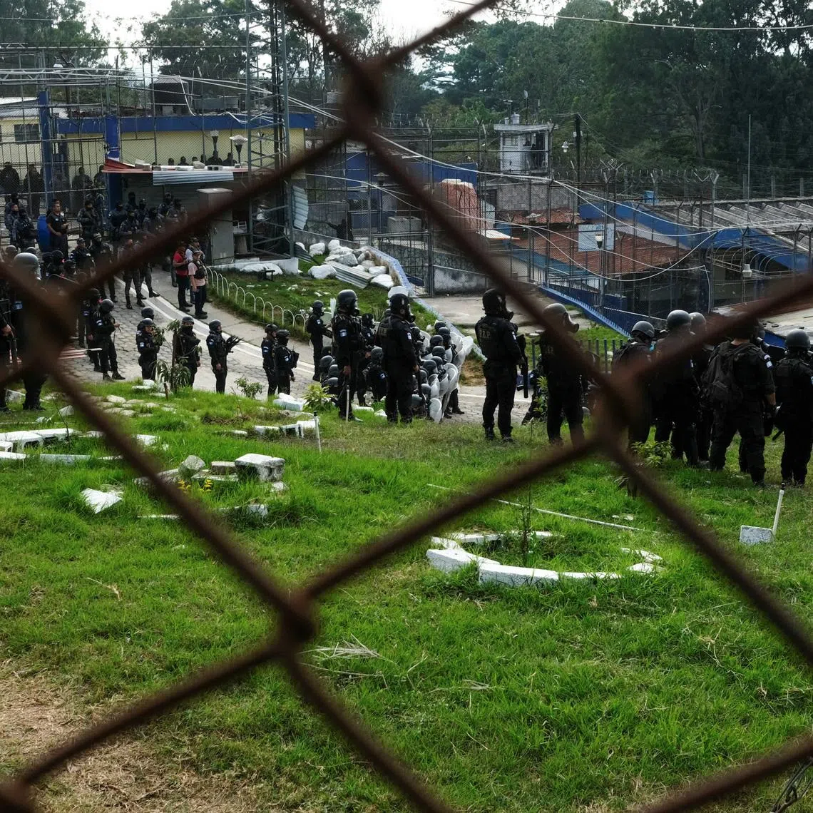 Riot police enter Zone 18 prison during gang violence following prison riots that left several police officers dead, in Guatemala City, Guatemala, January 18, 2026. REUTERS/Josue Decavele