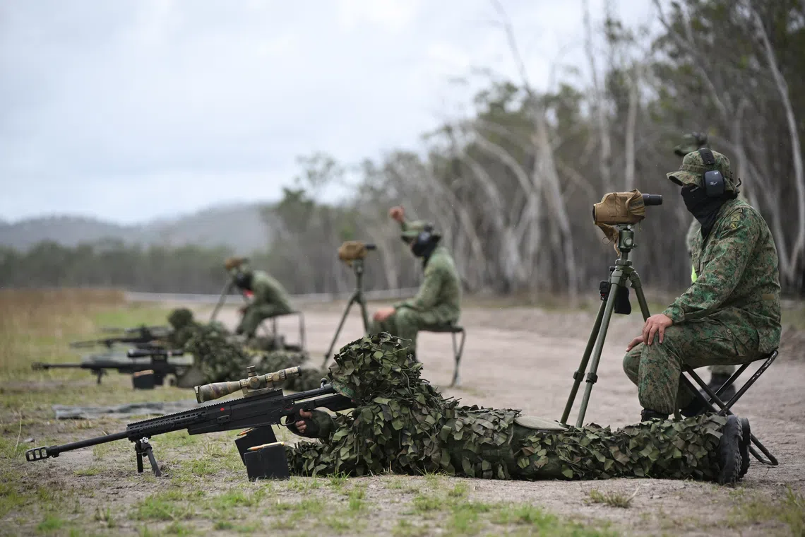 MSG Chin Shi Lee and other SAF snipers honing their skills in a live-firing exercise at Exercise Wallaby.