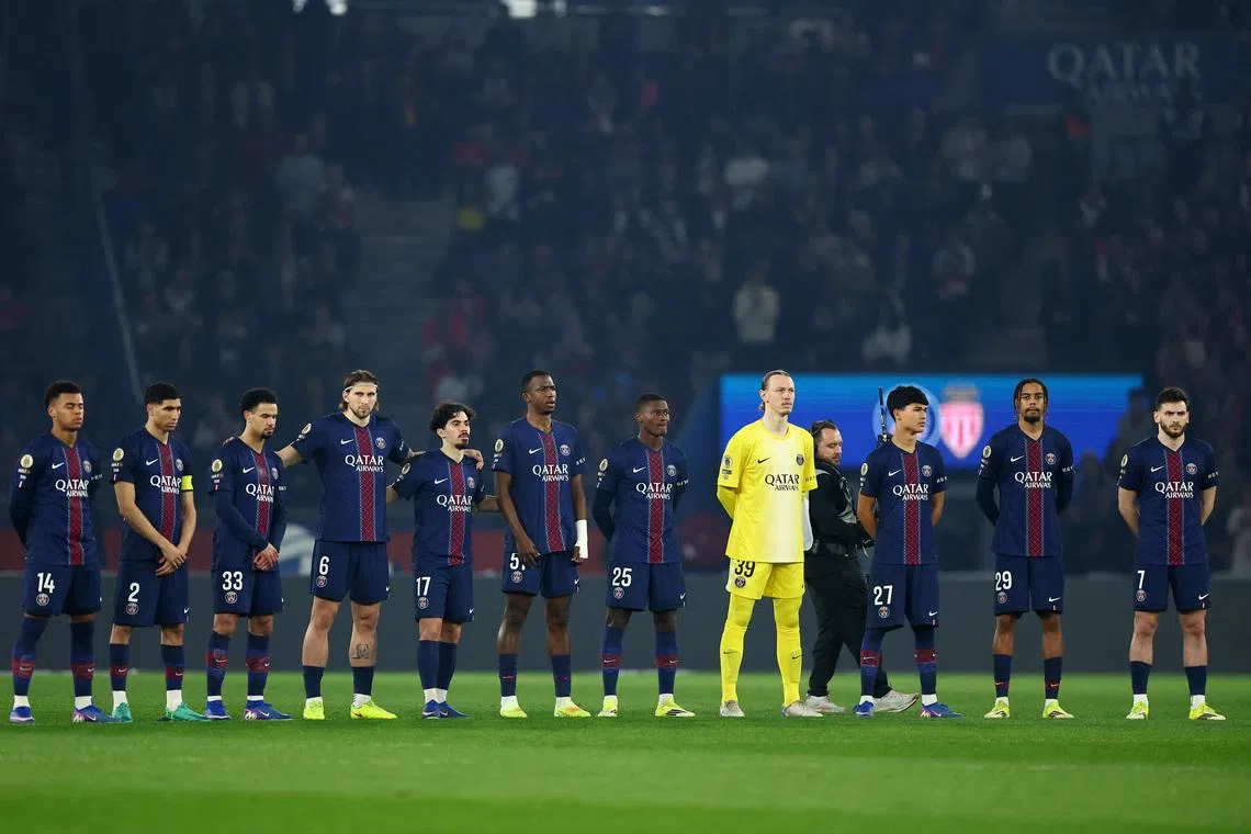 Soccer Football - Ligue 1 - Paris St Germain v AS Monaco - Parc des Princes, Paris, France - March 6, 2026 Paris St Germain players line up during a minute silence for the late Jack Jacquet before the start of the match REUTERS/Abdul Saboor