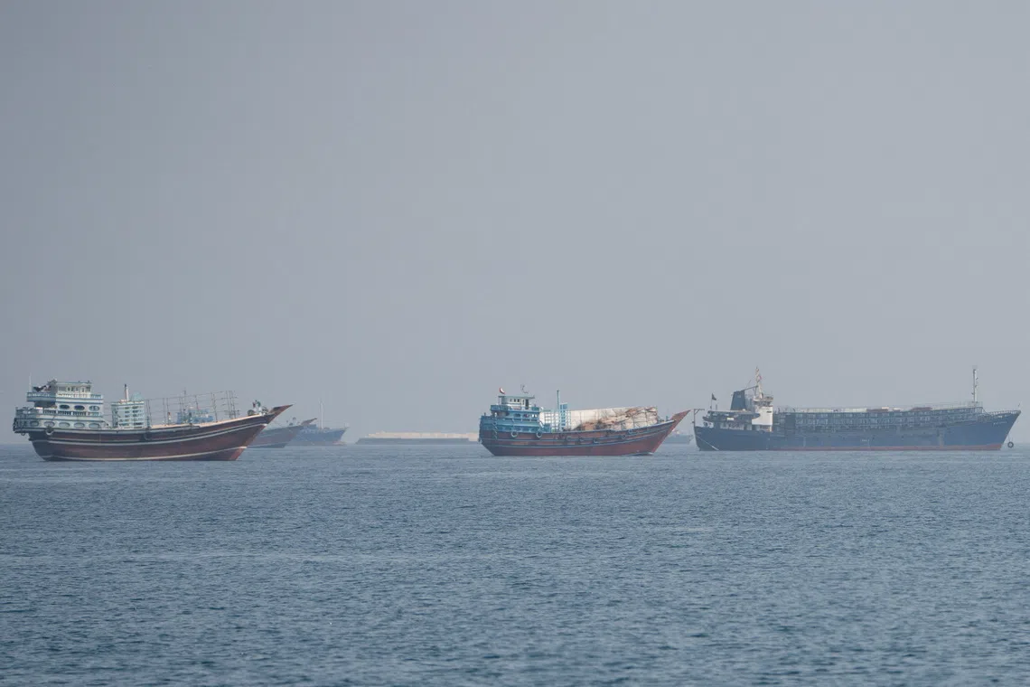 Vessels near the Strait of Hormuz, as seen from Musandam, Oman, August 24, 2026. REUTERS/Stringer