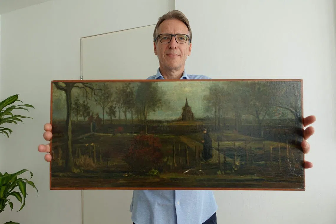 Dutch art detective Arthur Brand poses with Vincent Van Gogh's Parsonage Garden At Nuenen In Spring.