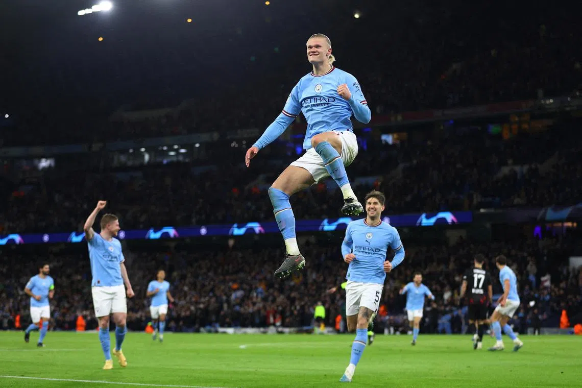 Erling Haaland celebrates scoring Manchester City's fifth goal.