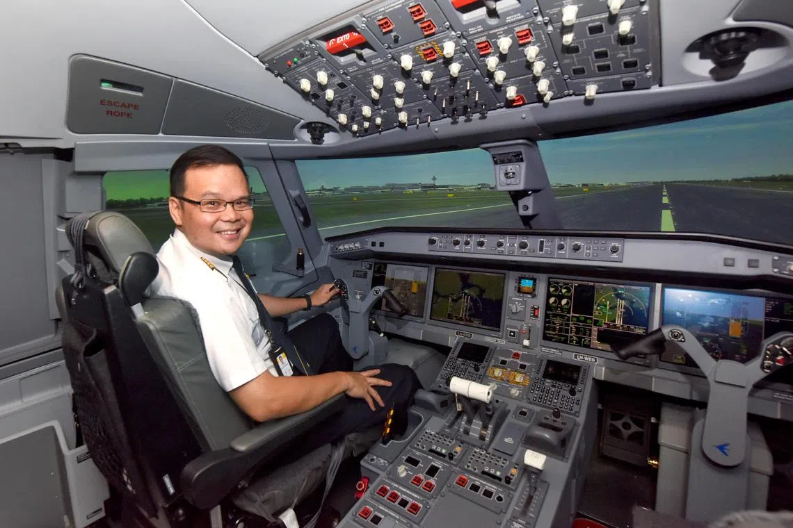 ST20240219_202499047836/eljet19/Heng Yi-Hsin/Esther Loi Profile of Mr Darius Yeo, 46, the chief pilot for the Embraer E2 and E190 in the Embraer-CAE E-Jets E2 full flight simulator at Singapore Airlines Training Centre on Feb 19, 2024. ST PHOTO: HENG YI-HSIN