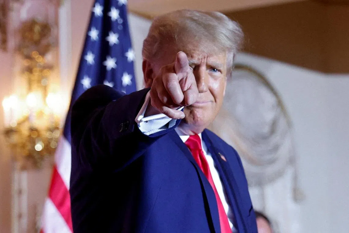 FILE PHOTO: Former U.S. President Donald Trump points as he announces that he will once again run for U.S. president in the 2024 U.S. presidential election during an event at his Mar-a-Lago estate in Palm Beach, Florida, U.S. November 15, 2022. REUTERS/Jonathan Ernst/File Photo