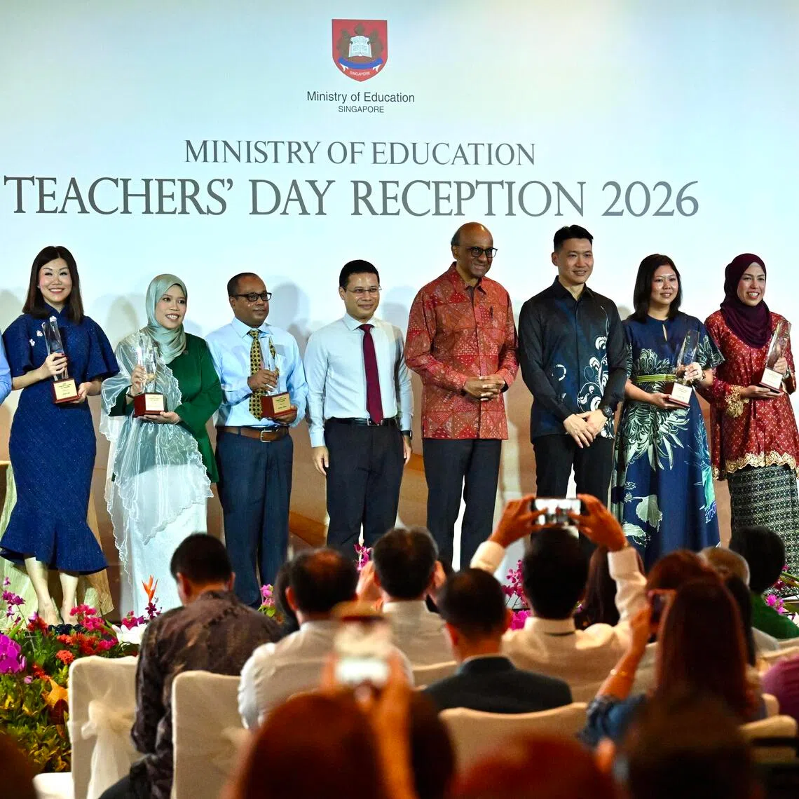 The award recipients with President Tharman Shanmugaratnam (centre) at the annual Teachers’ Day Reception on Sept 3. Joining them are Minister for Education Desmond Lee (fifth from left) and Second Minister for Education David Neo (fifth from right).