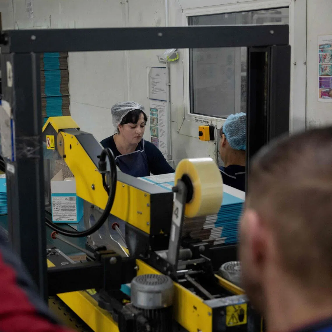 Employees at households goods producer Biosphere work at a factory in Dnipro on April 21. 