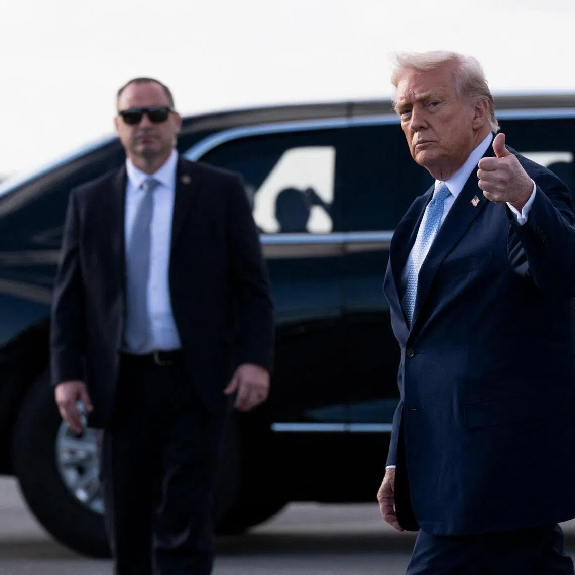 PALM BEACH, FLORIDA - MARCH 20: U.S. President Donald Trump gives a thumbs up after landing at Palm Beach International Airport on March 20, 2026 in Palm Beach, Florida. President Trump is scheduled to spend the weekend at his South Florida Estate of Mar-a-Lago in West Palm Beach.   Roberto Schmidt/Getty Images/AFP (Photo by ROBERTO SCHMIDT / GETTY IMAGES NORTH AMERICA / Getty Images via AFP)