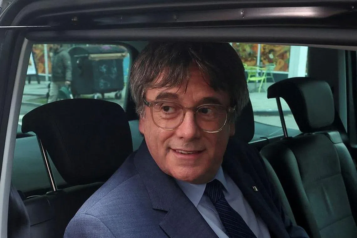 FILE PHOTO: Catalan separatist leader Carles Puigdemont sits inside a car, on the day a deal was signed with Spanish Socialist Workers' Party (PSOE) for Spanish government support, which is expected to include an amnesty law for Catalan separatist activists, in Brussels, Belgium November 9, 2023.  REUTERS/Yves Herman/File Photo