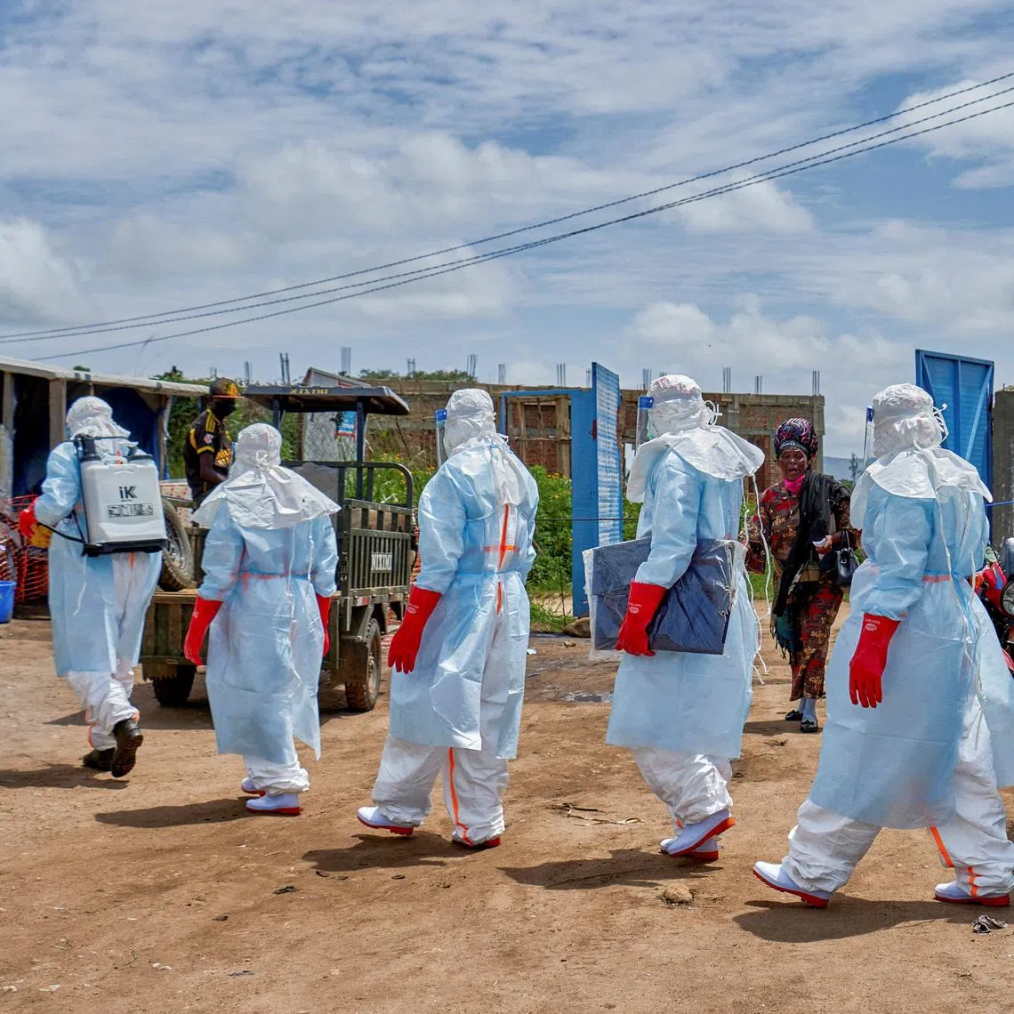 Red Cross workers heading to disinfect a Rwampara hospital before handling the body of a person who died of Ebola, in Rwampara outside Bunia, Ituri province, Democratic Republic of Congo, on May 21.