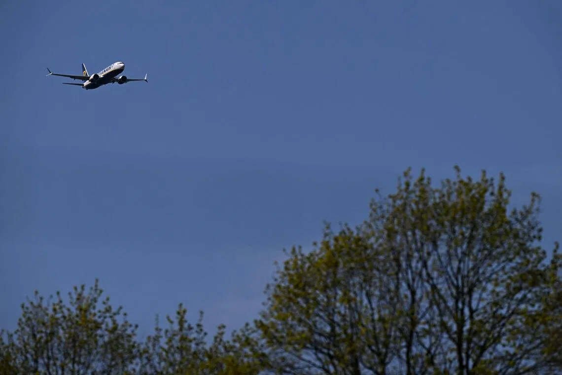 A Boeing 737 MAX 8-200 passenger aircraft operated by Ryanair prepares to land at Liverpool John Lennon Airport in Liverpool, north west England on April 22, 2026. The EU unveiled on April 22 plans to address the energy crisis triggered by the war in the Middle East, including improved monitoring of jet fuel supplies as the prospect of shortages rattles Europe ahead of the summer travel season. (Photo by Paul ELLIS / AFP)